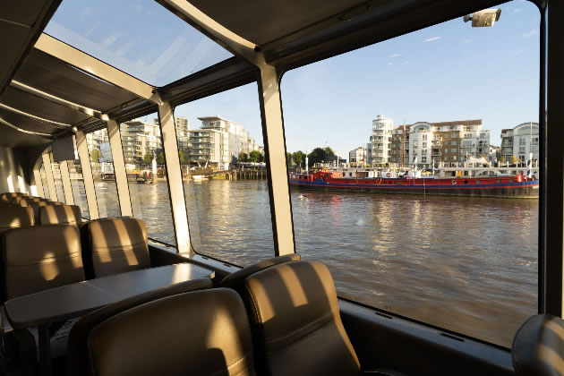 Passengers enjoy large windows which look out onto views along the Thames 