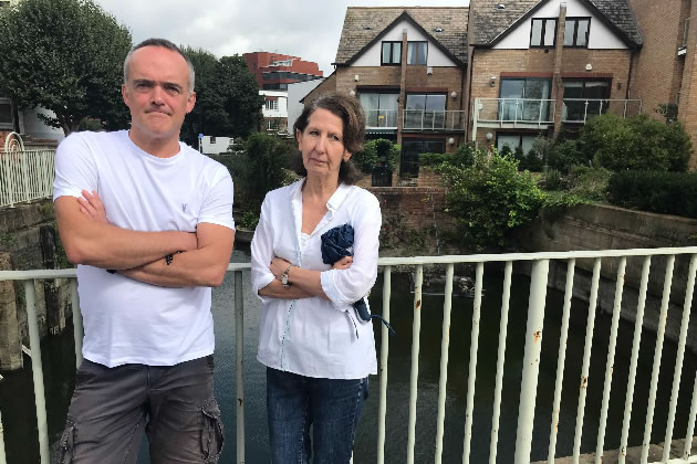 Alan Barker and Mandy in front of 'London's most expensive wall' 