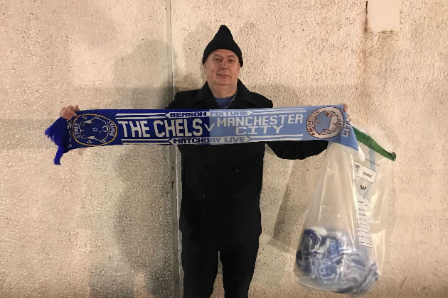 Trading officer Doug Love with claimed scarves outside Stamford Bridge Stadiu