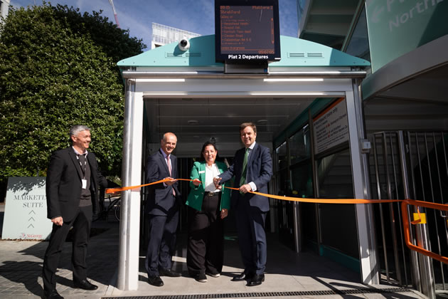 Greg Hands MP cuts the ribbon at the new station entrance