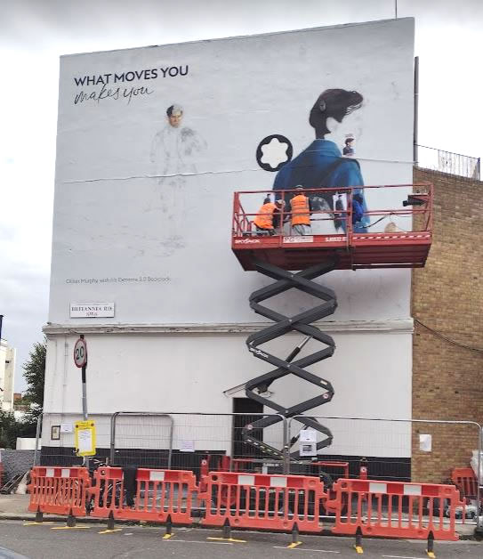 The mural being painted by hand 