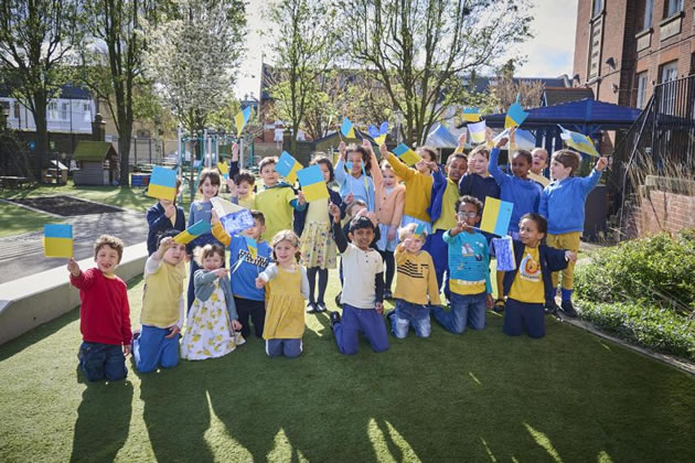 The children celebrate their achievement 