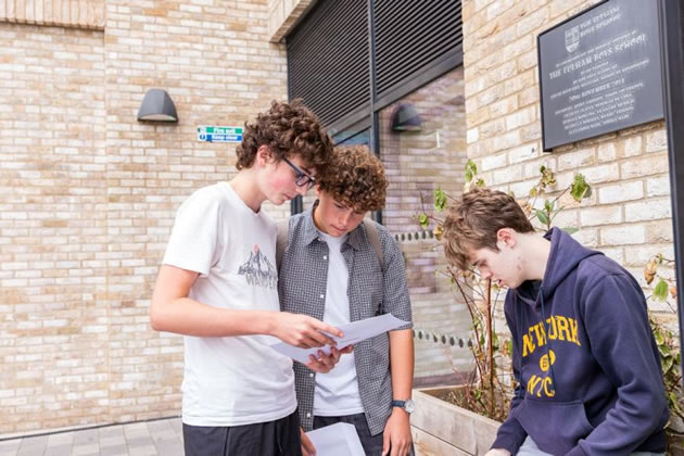 Fulham Boys School students open their envelope