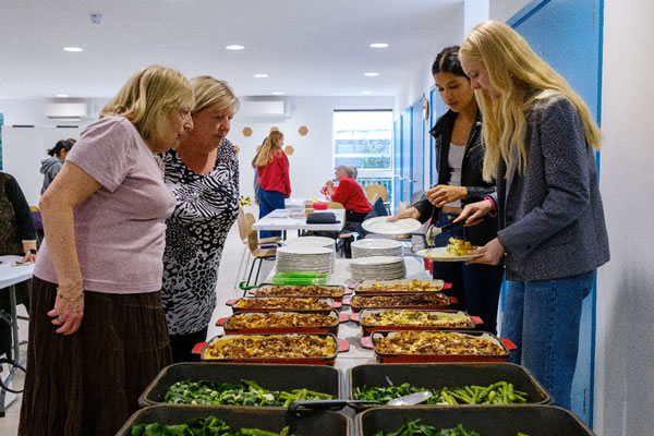 Students serve up three-course meal to elderly residents