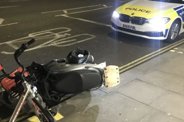 Moped Rider Mounts Pavement in Hammersmith Road Chase